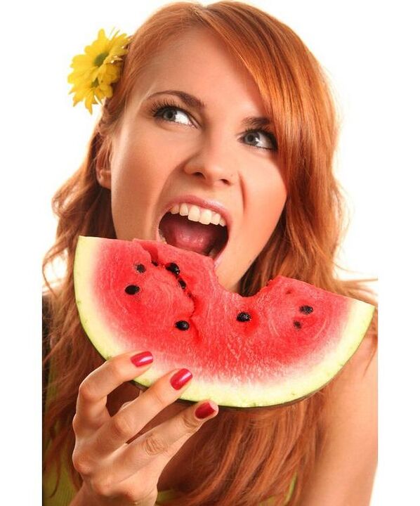 The girl eats a watermelon diet